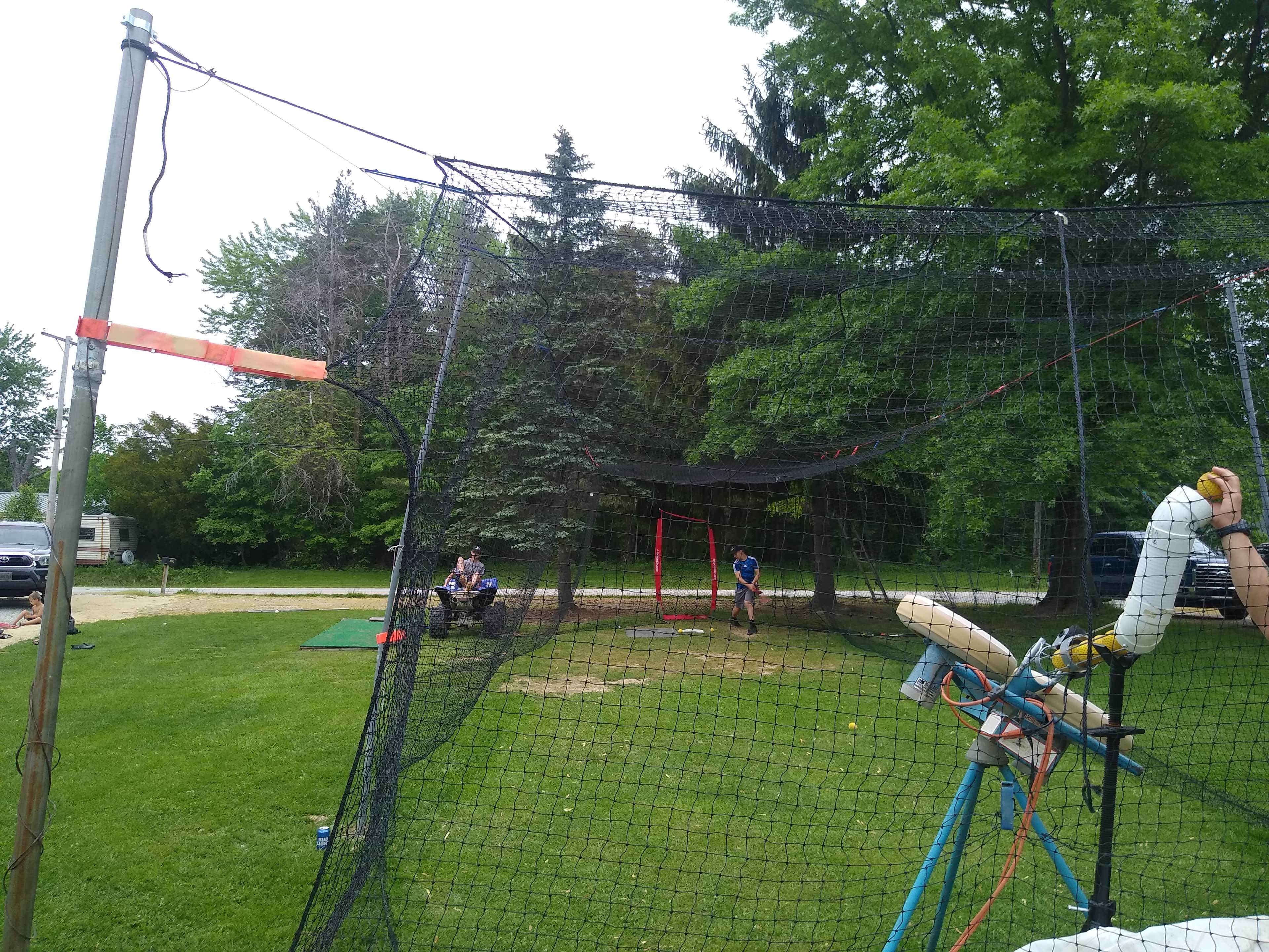 Outdoor Batting Cage in Geneva, OH — Pitching Machine & Baseball