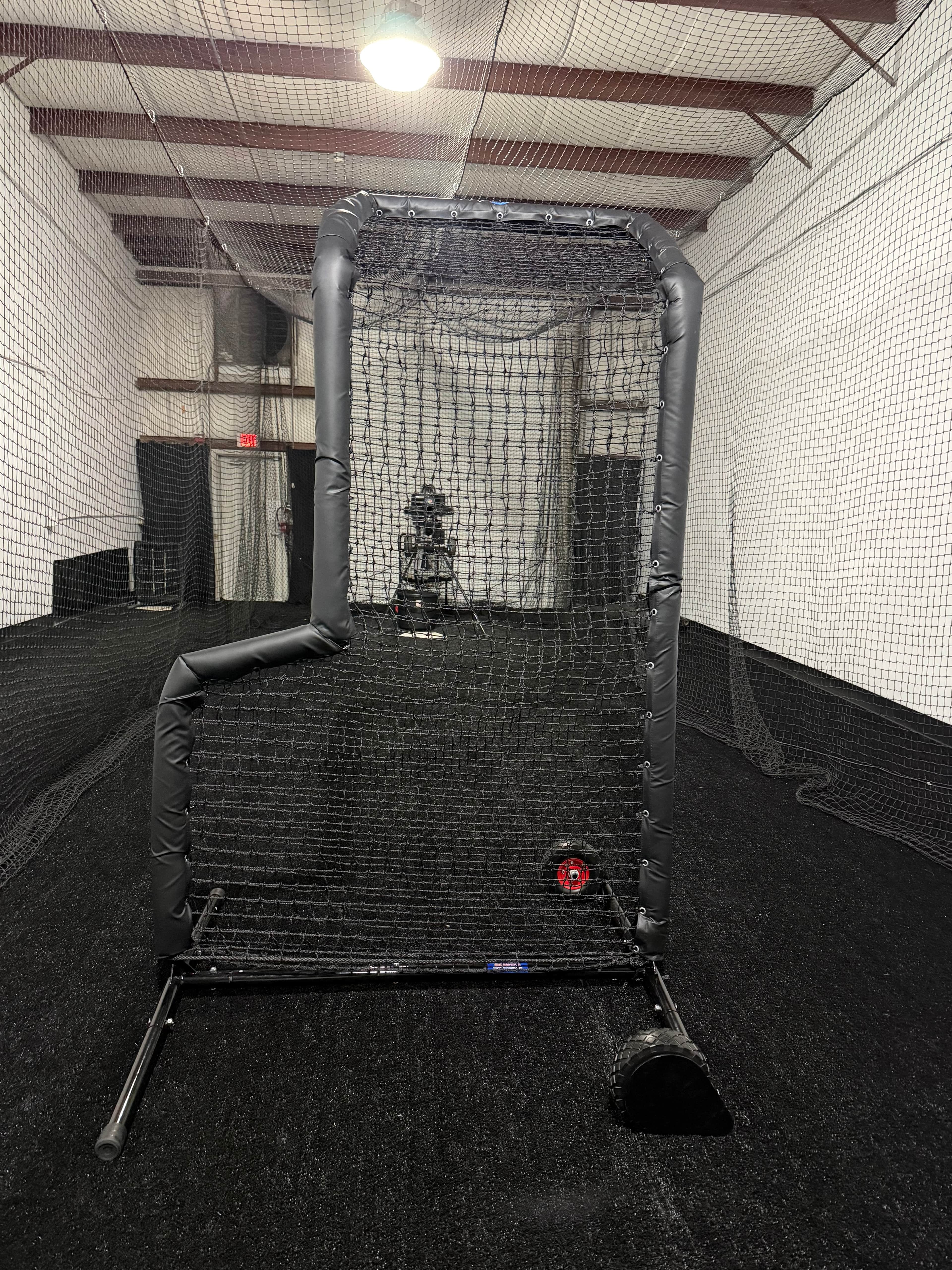 Private batting cage with mound and pitching machine in Sarasota, FL